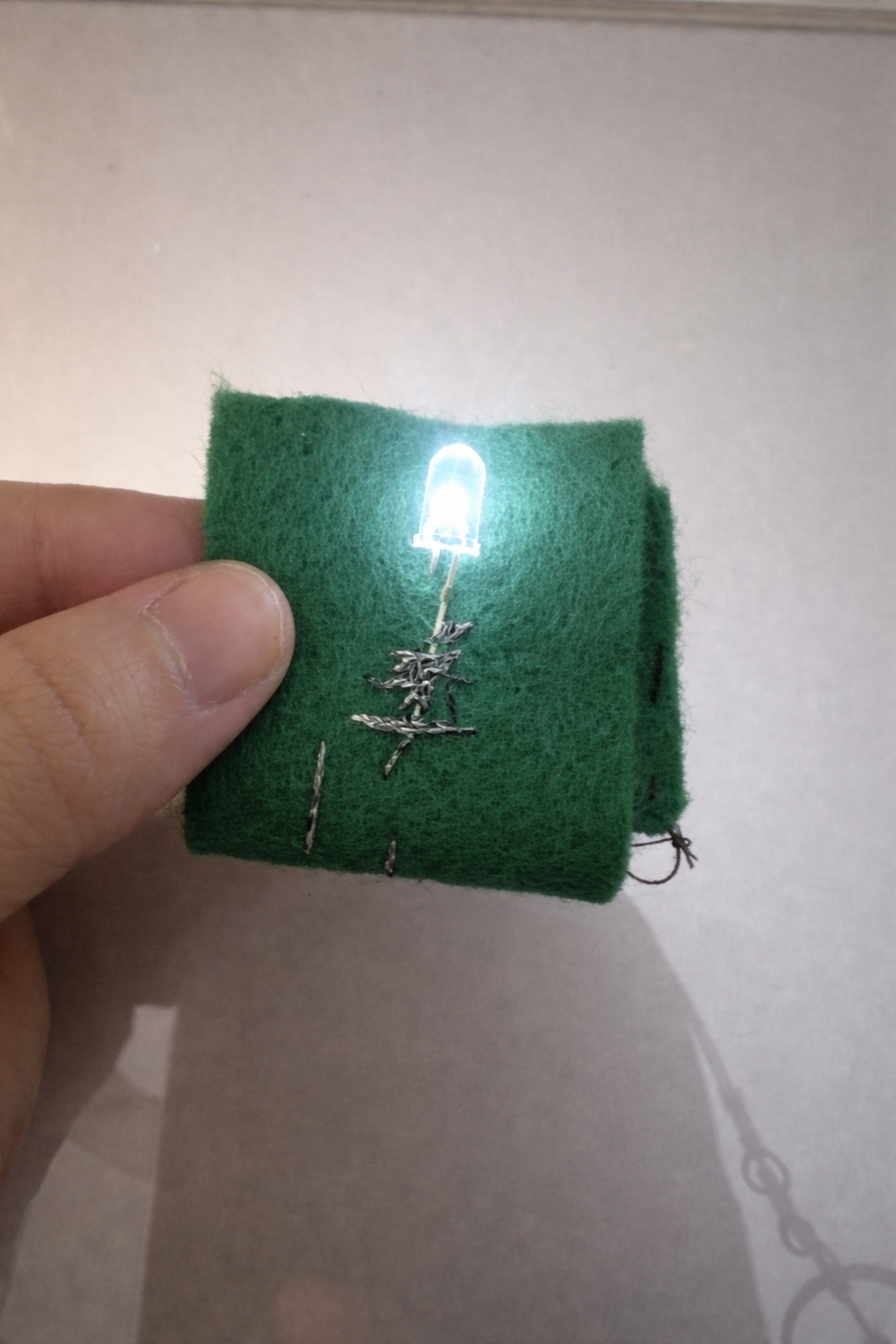 This worked very well. I think it may be because I used very thick conductive thread.
