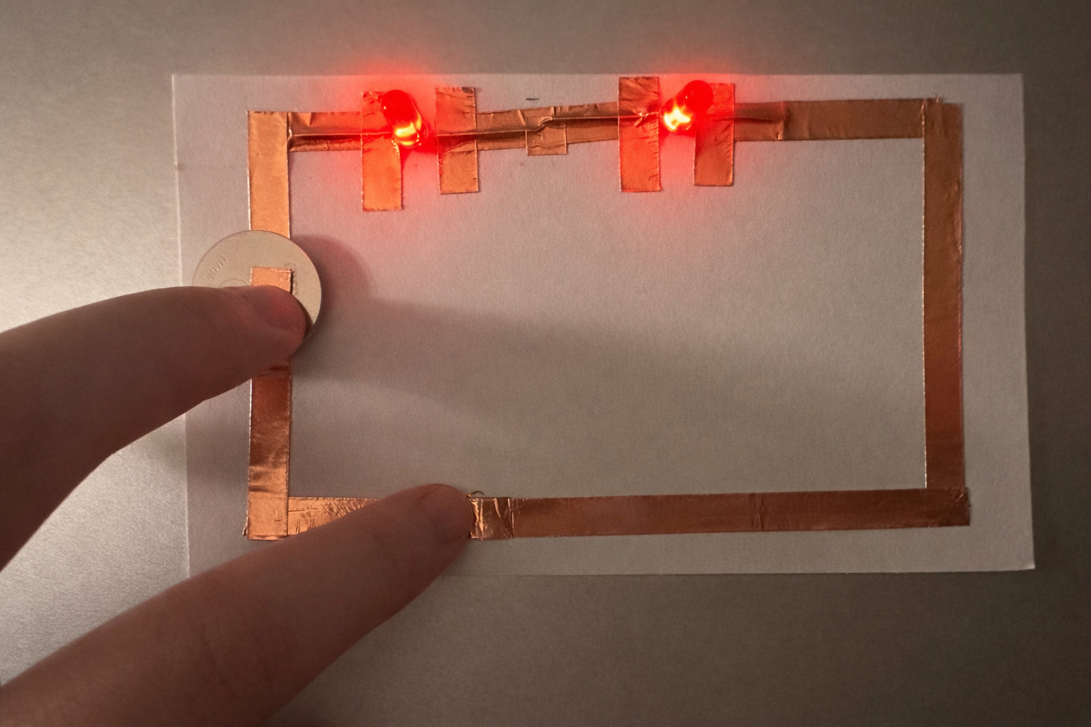 This is a series circuit. I followed the same process by drawing the circuit first and then placing copper tape. It worked very well.
