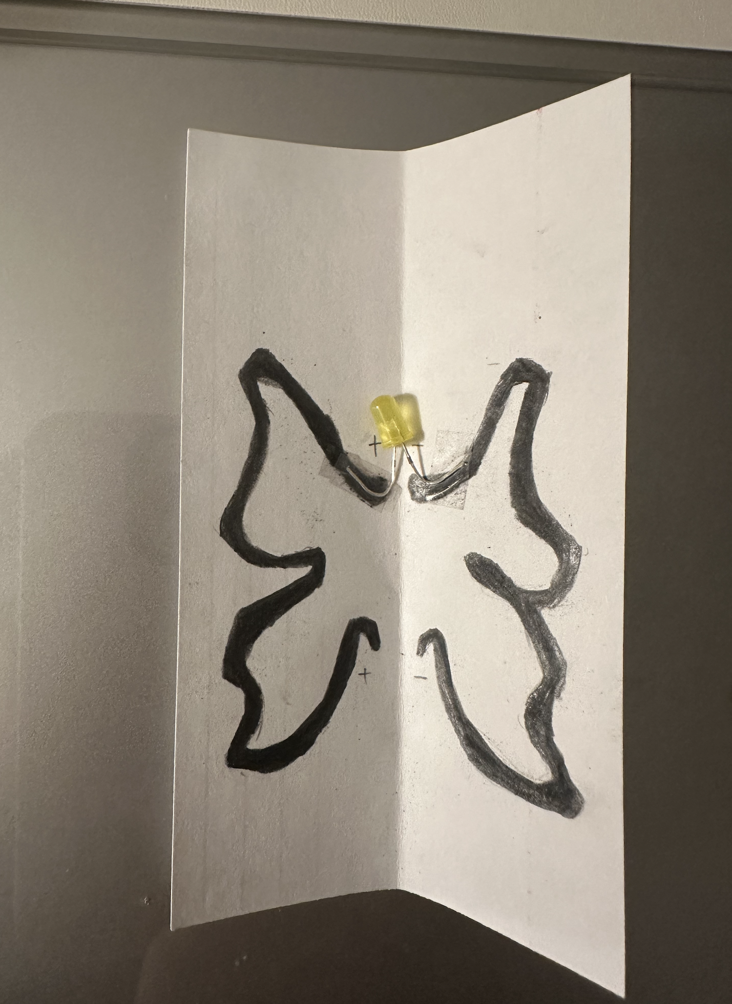 I taped the LED onto the points where the lines connected.