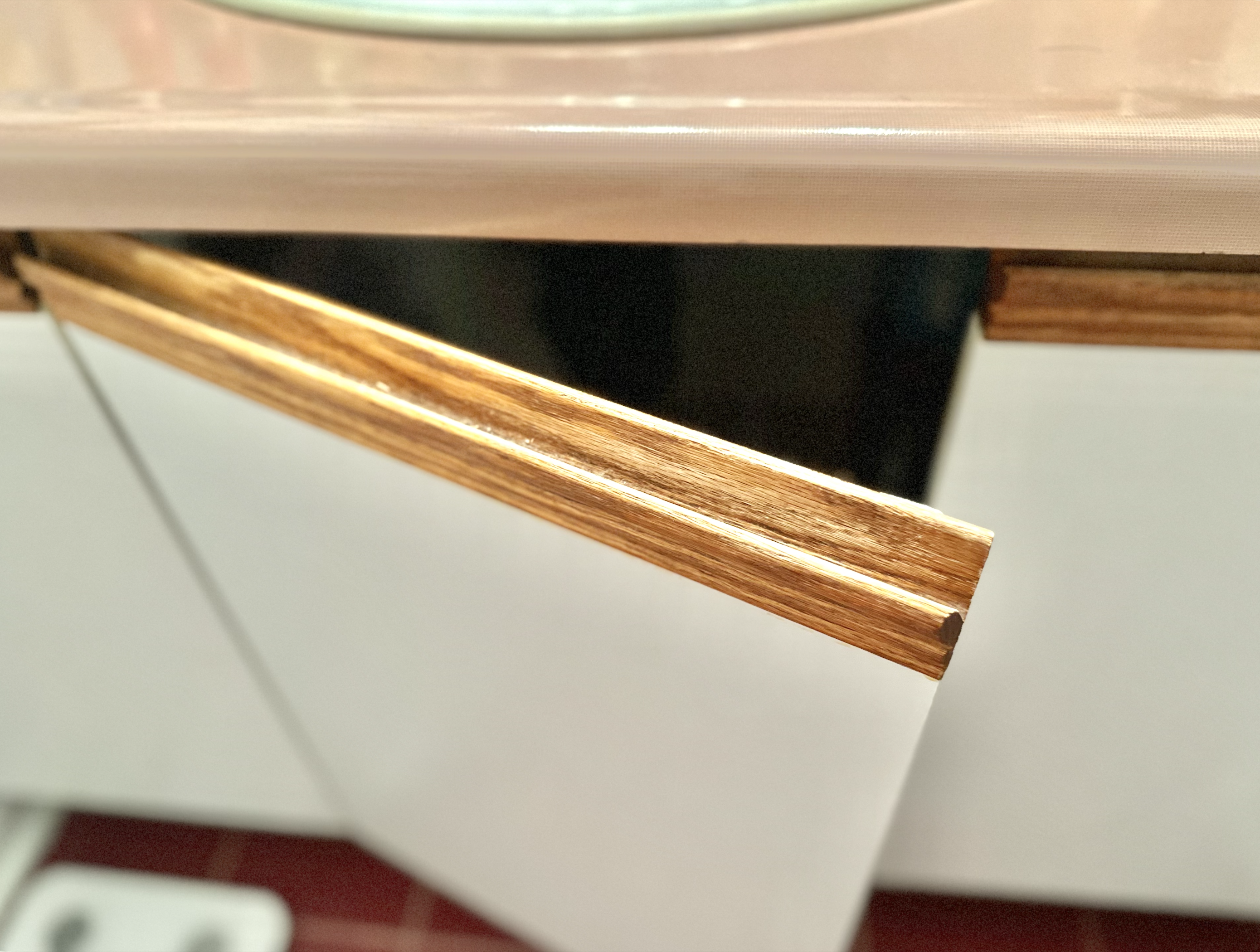 The wooden cabinet door in an open position