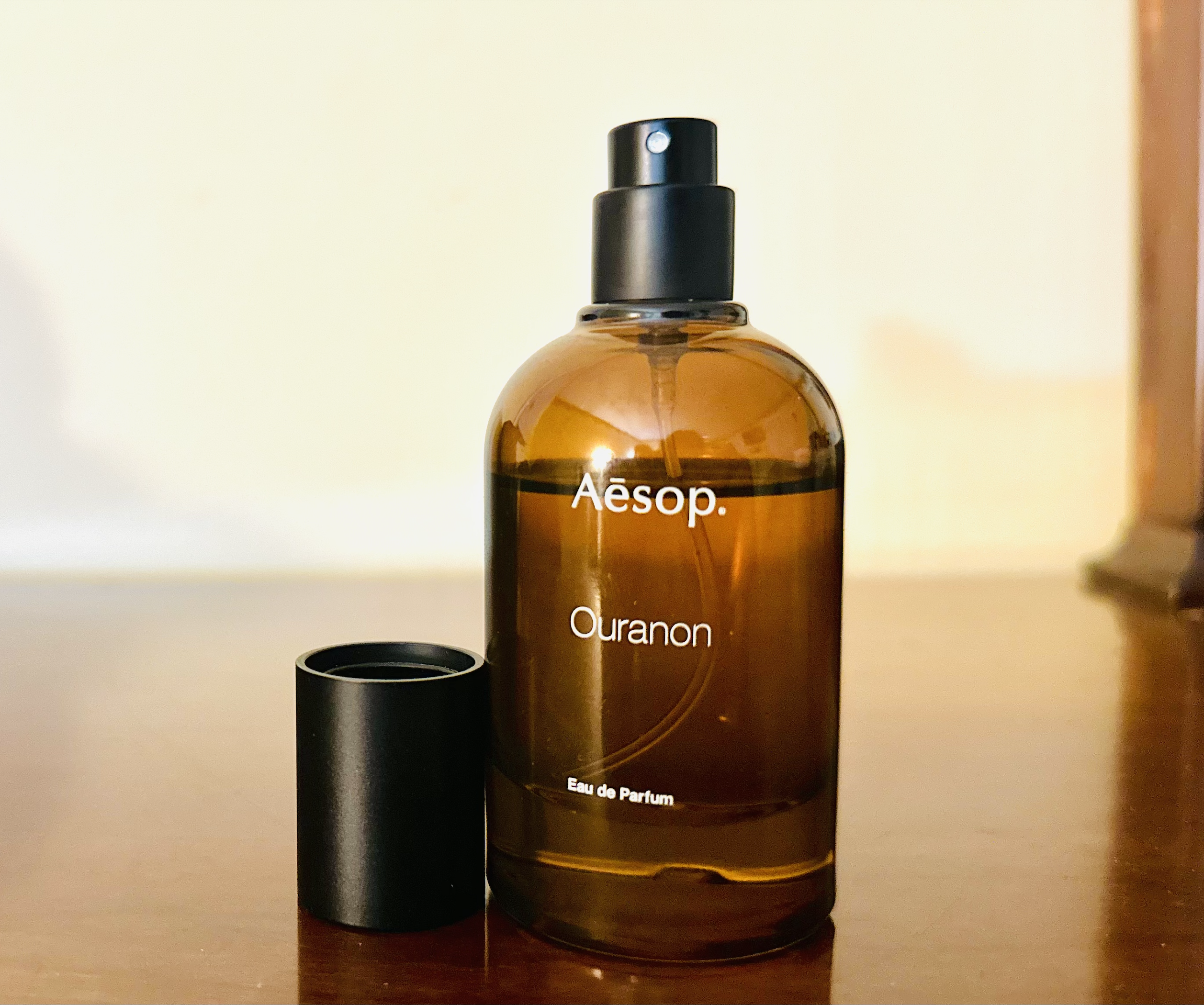 Close-up view of the perfume bottle and spray nozzle